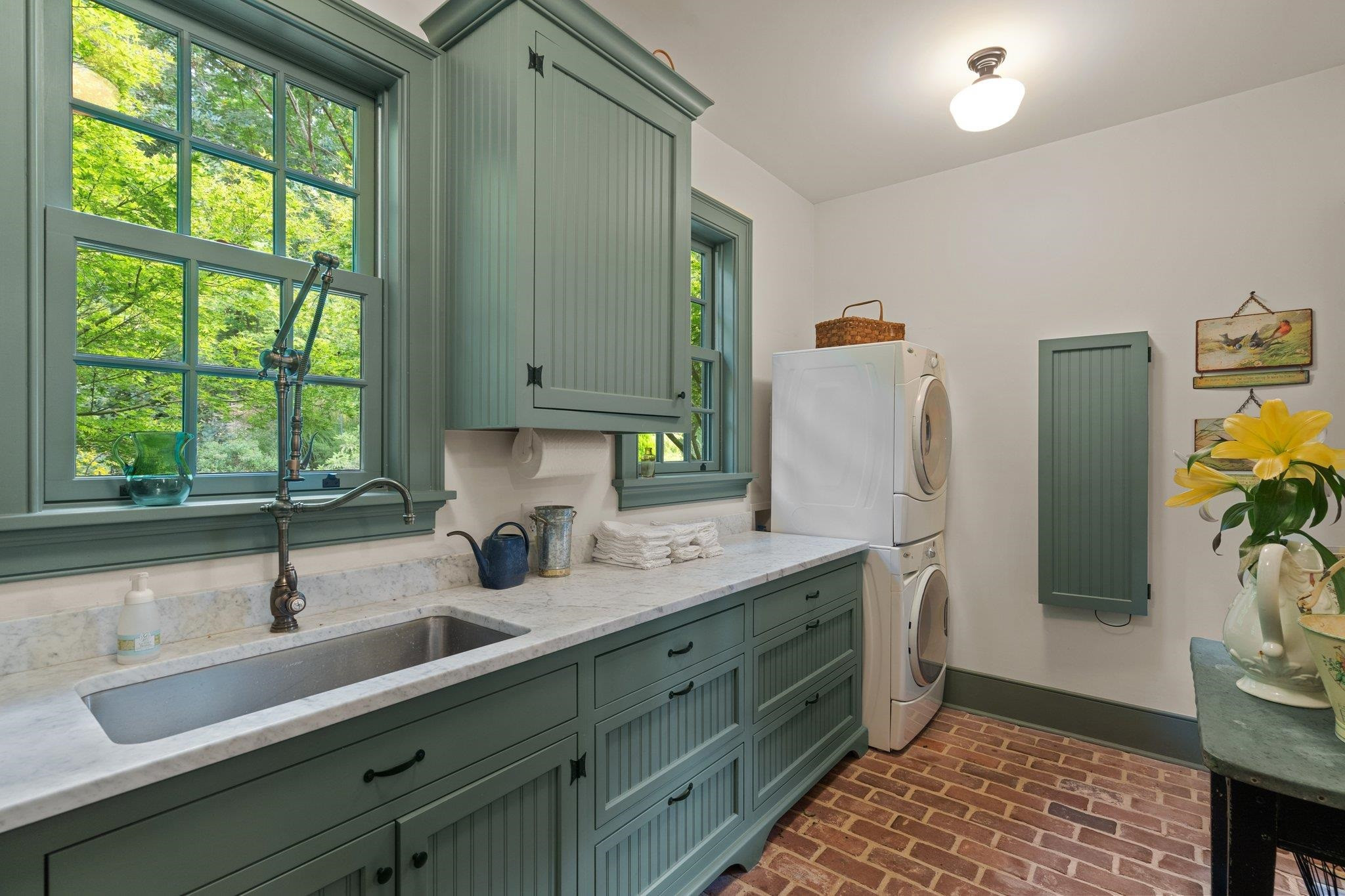 4900 West Cornwallis Road Durham, NC 27705 - Photo 58 of 100 a kitchen with stainless steel appliances a sink a refrigerator and a window