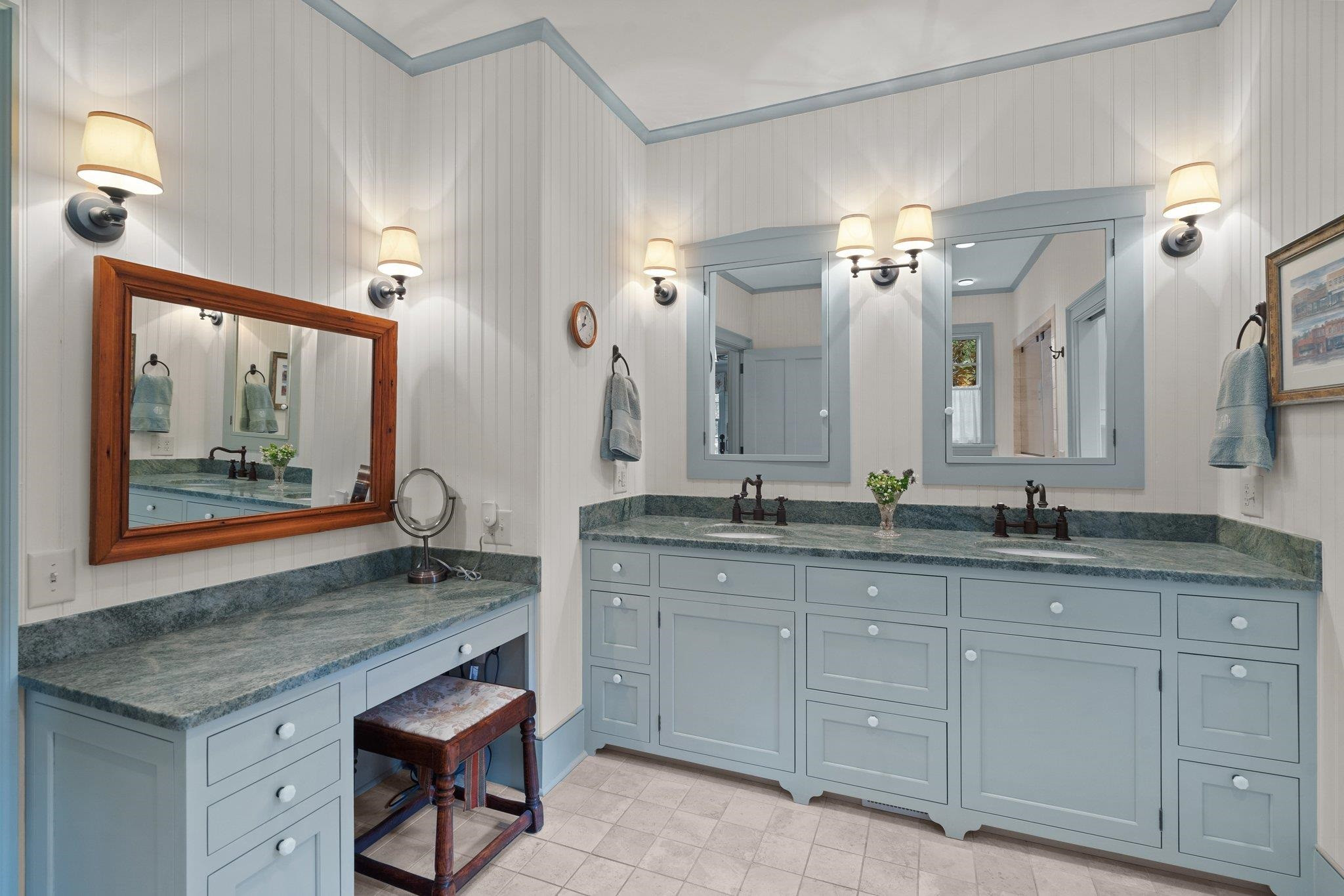 4900 West Cornwallis Road Durham, NC 27705 - Photo 64 of 100 a spacious bathroom with a granite countertop sink a mirror and a