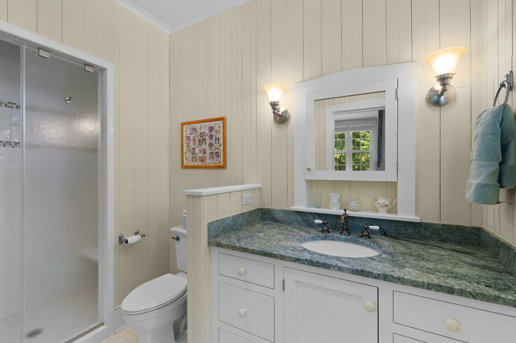 4900 West Cornwallis Road Durham, NC 27705 - Photo 68 of 100 a bathroom with a granite countertop sink a toilet and a mirror