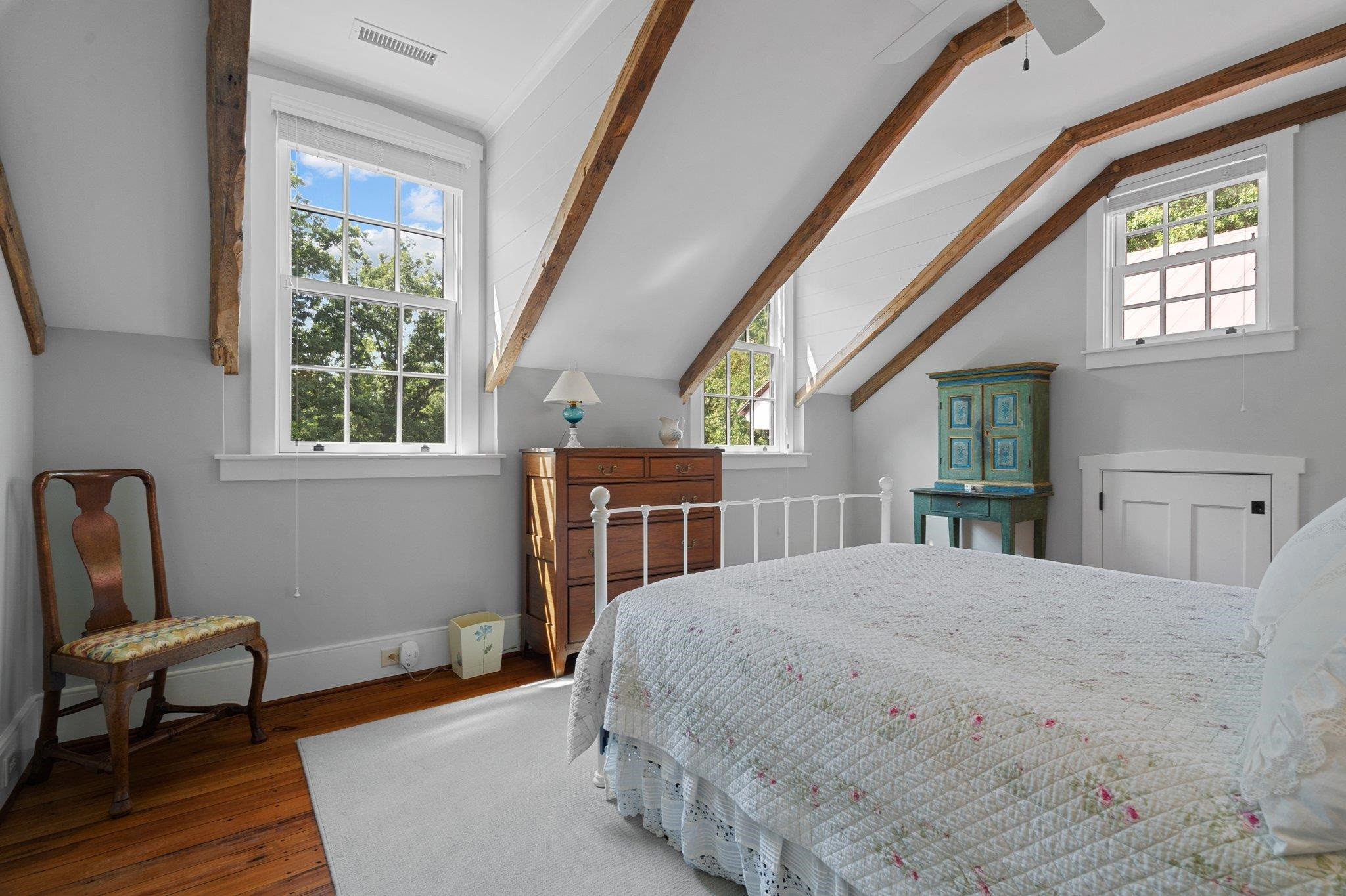 4900 West Cornwallis Road Durham, NC 27705 - Photo 72 of 100 a bedroom with a bed a table and chair