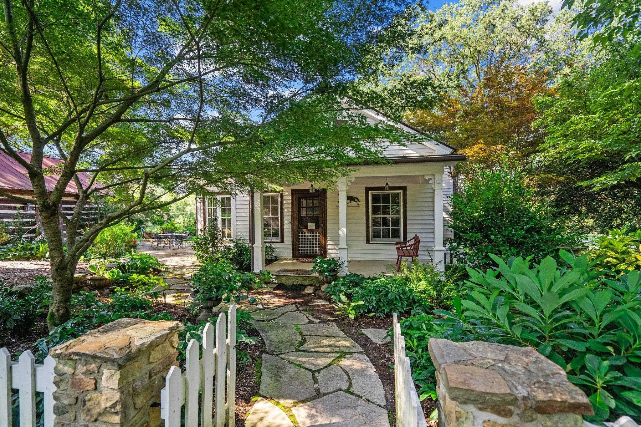 4900 West Cornwallis Road Durham, NC 27705 - Photo 77 of 100 a front view of house with yard and trees around