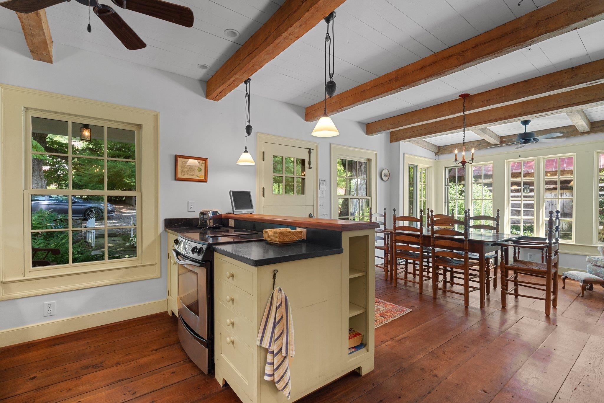 4900 West Cornwallis Road Durham, NC 27705 - Photo 82 of 100 a view of a dining room with furniture window and wooden floor
