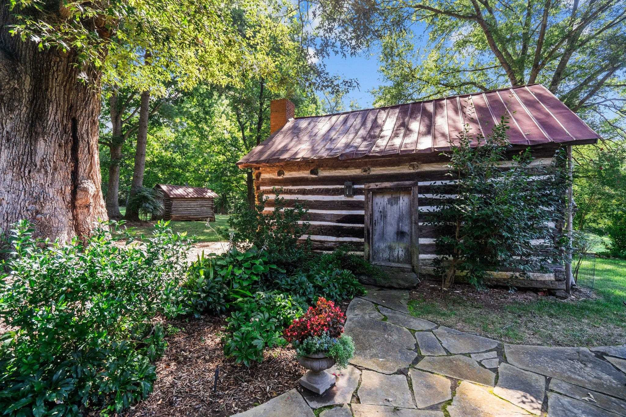 4900 West Cornwallis Road Durham, NC 27705 - Photo 86 of 100 a view of a patio with table and chairs and potted plants