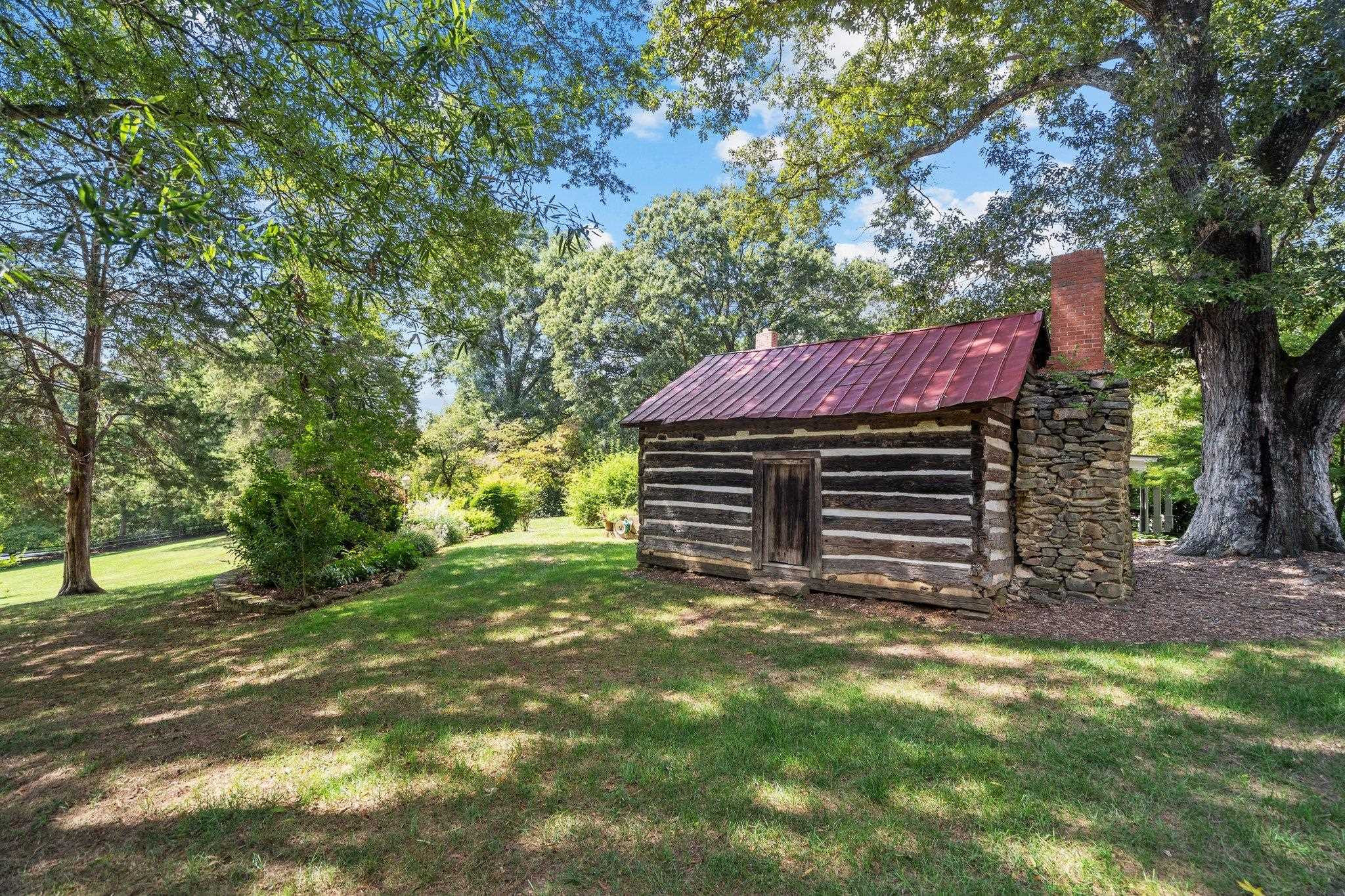 4900 West Cornwallis Road Durham, NC 27705 - Photo 98 of 100 a view of a house with a yard