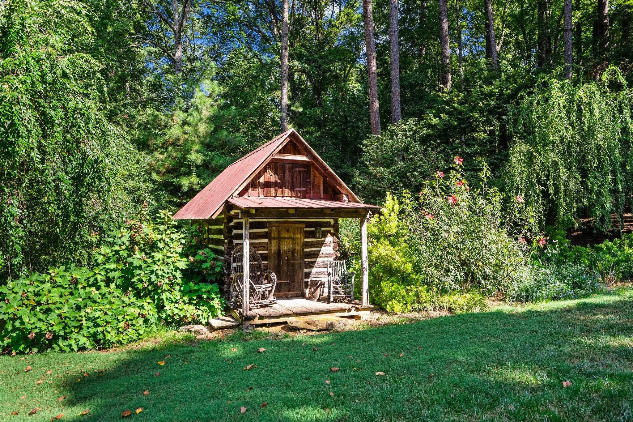 4900 West Cornwallis Road Durham, NC 27705 - Photo 100 of 100 a front view of a house with yard and green space