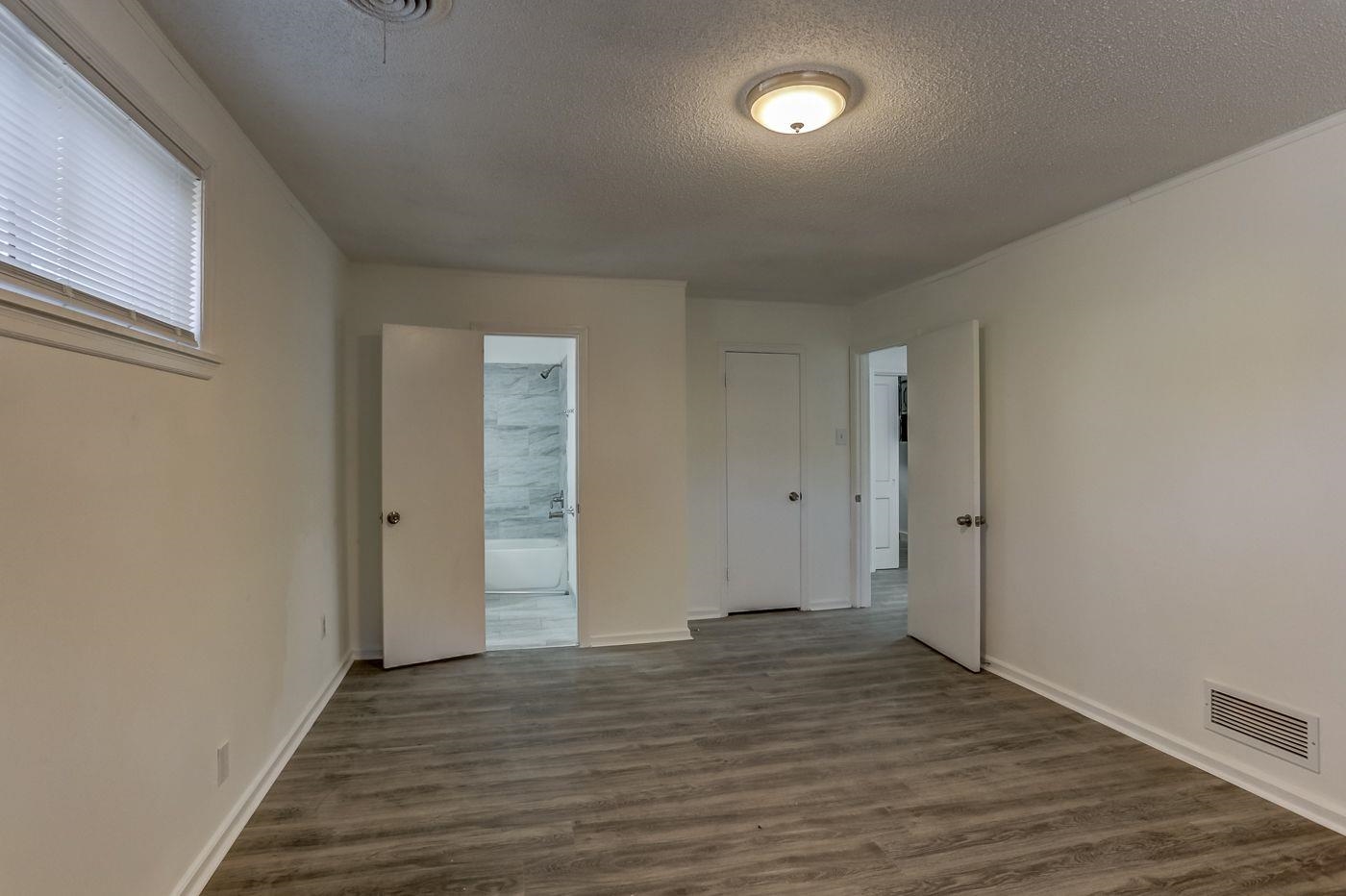 4518 Garnett Road Memphis, TN 38117 - Photo 12 of 22 a view of an empty room and wooden floor
