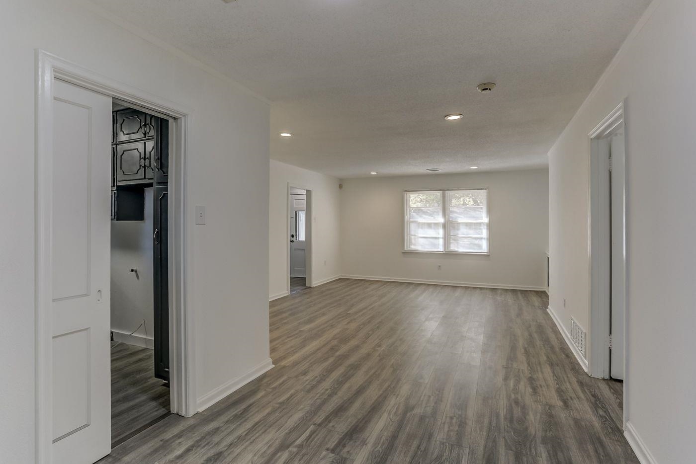 4518 Garnett Road Memphis, TN 38117 - Photo 13 of 22 a view of empty room with window and wooden floor
