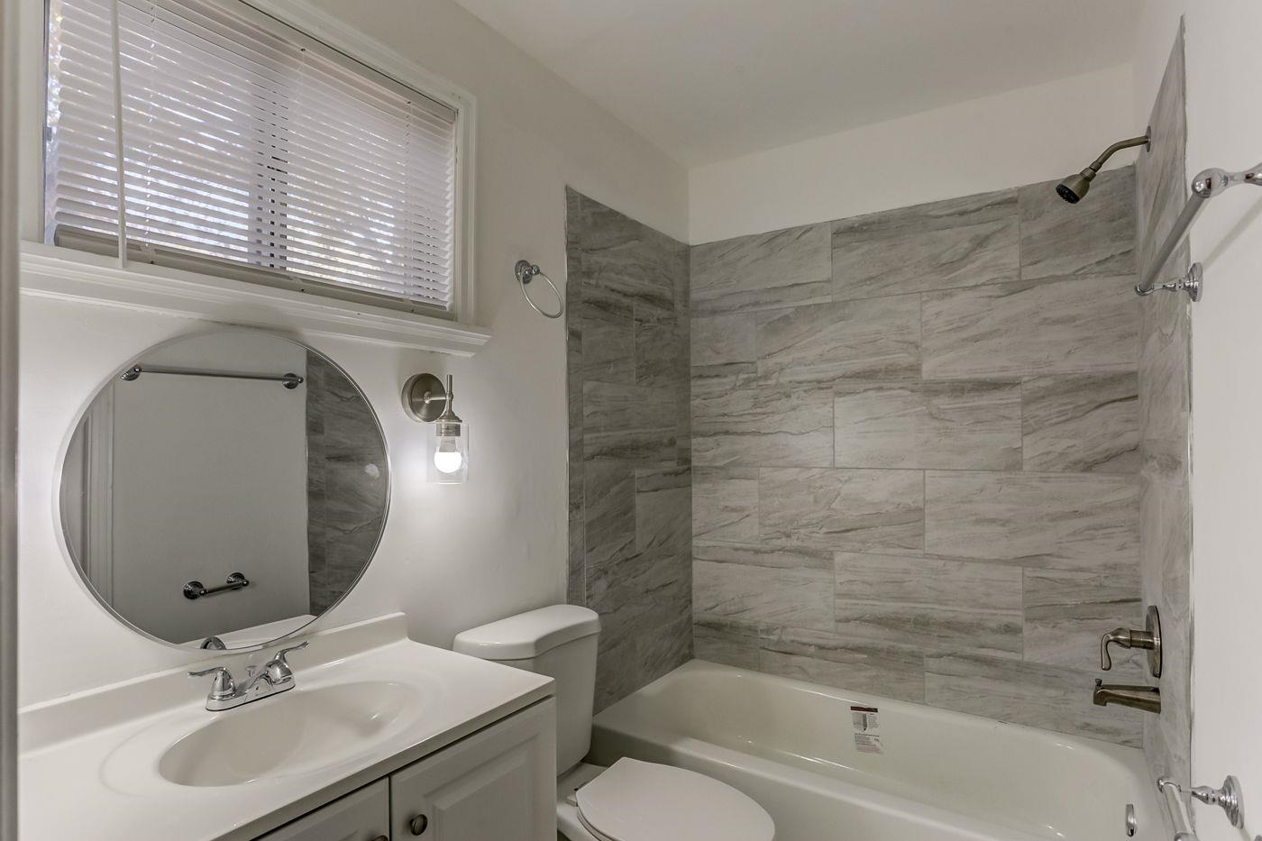 4518 Garnett Road Memphis, TN 38117 - Photo 6 of 22 a bathroom with a sink toilet and shower