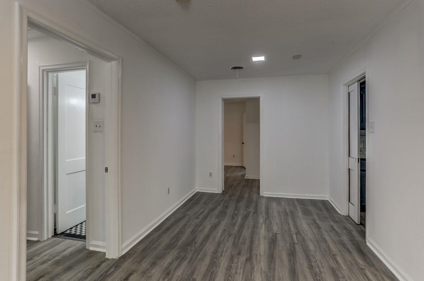 4518 Garnett Road Memphis, TN 38117 - Photo 9 of 22 a view of a hallway with wooden floor