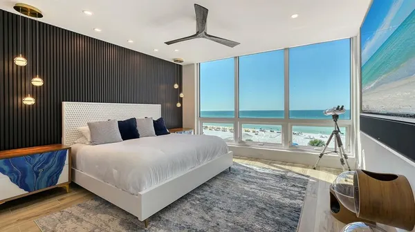 a bedroom with a bed and a lamp
