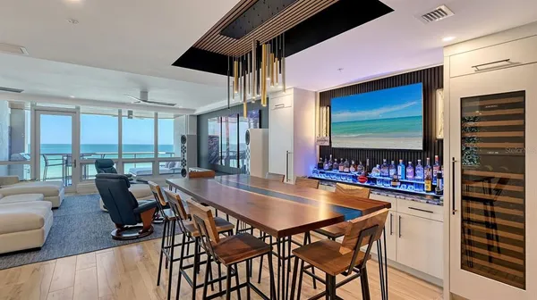 a dining room with furniture and wooden floor