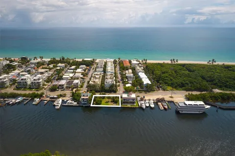 an aerial view of a house with a ocean view