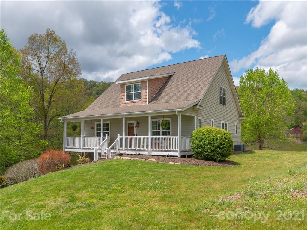 56 Porters Ridge Canton, NC 28716 - Photo 1 of 32 a front view of a house with garden