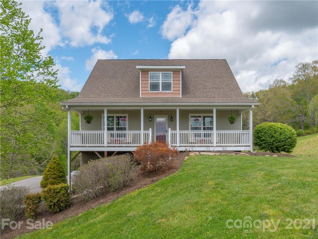 56 Porters Ridge Canton, NC 28716 - Photo 2 of 32 a front view of a house with a garden