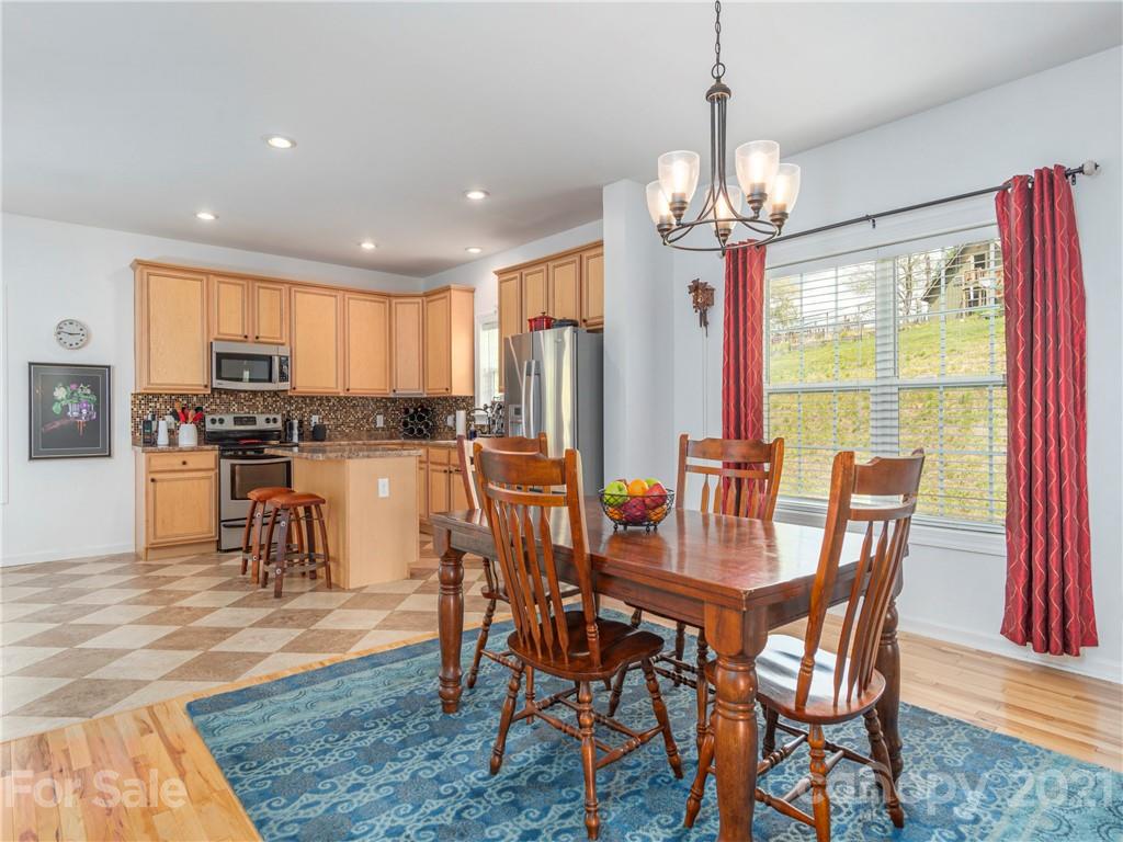 56 Porters Ridge Canton, NC 28716 - Photo 12 of 32 a view of a dining room with furniture window and outside view