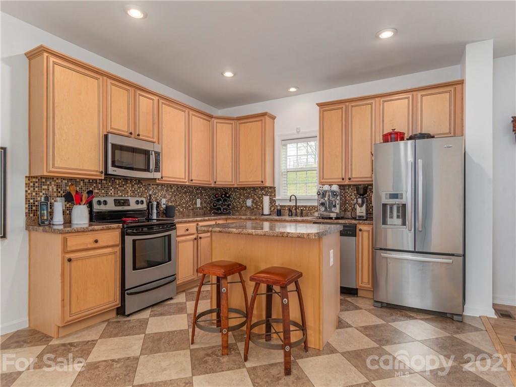 56 Porters Ridge Canton, NC 28716 - Photo 13 of 32 a kitchen with granite countertop a refrigerator stove top oven and sink