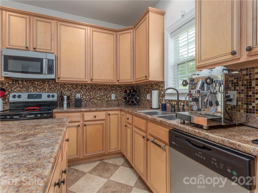 56 Porters Ridge Canton, NC 28716 - Photo 15 of 32 a kitchen with stainless steel appliances granite countertop a stove a sink and a microwave