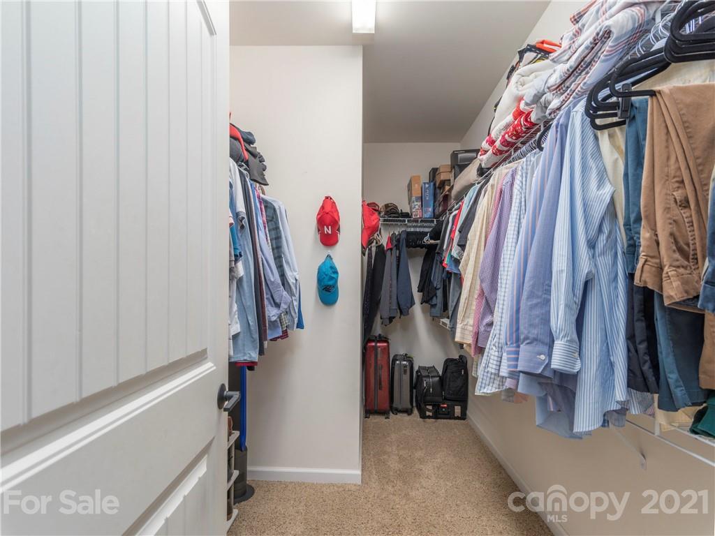 56 Porters Ridge Canton, NC 28716 - Photo 20 of 32 a view of walk in closet with clothes