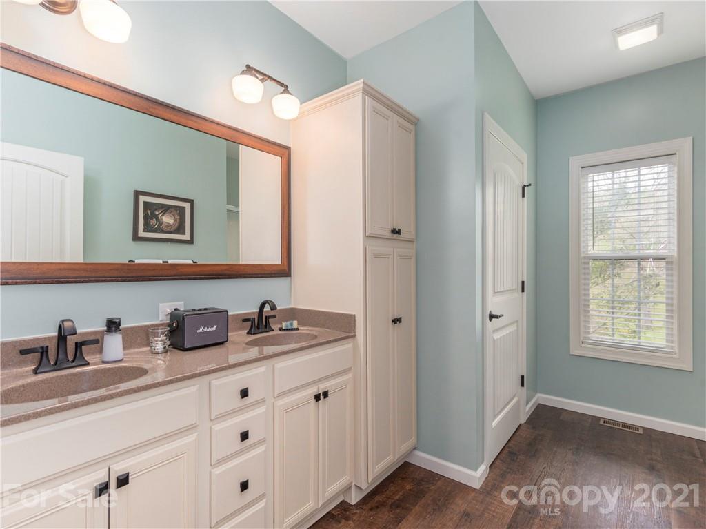 56 Porters Ridge Canton, NC 28716 - Photo 21 of 32 a bathroom with double sink and a window