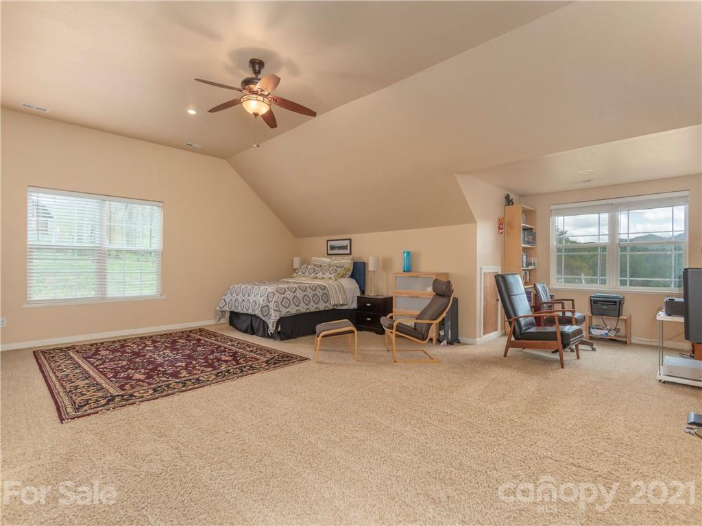 56 Porters Ridge Canton, NC 28716 - Photo 22 of 32 a living room with furniture and a chandelier