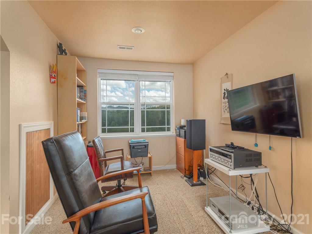 56 Porters Ridge Canton, NC 28716 - Photo 24 of 32 a living room with furniture and a flat screen tv