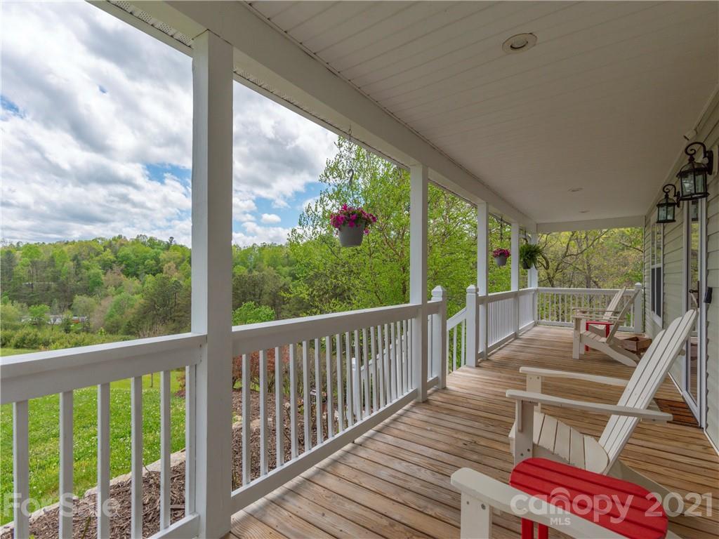 56 Porters Ridge Canton, NC 28716 - Photo 4 of 32 a view of balcony with couch and wooden floor