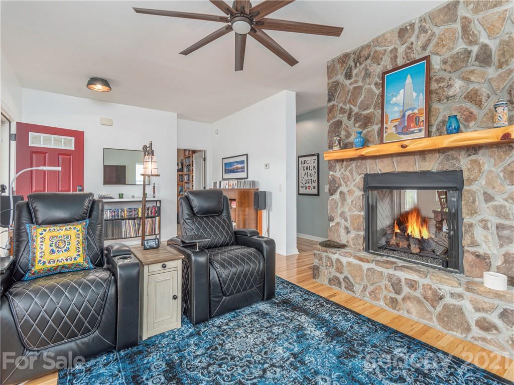 56 Porters Ridge Canton, NC 28716 - Photo 9 of 32 a living room with furniture a rug and a fireplace