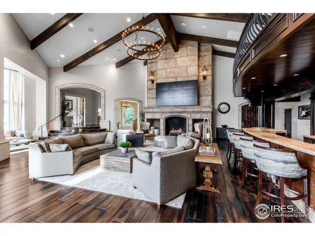 a living room with lots of furniture and a chandelier