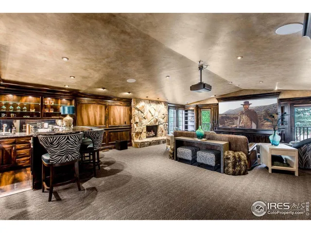 a spacious bedroom with a large bed and a large window