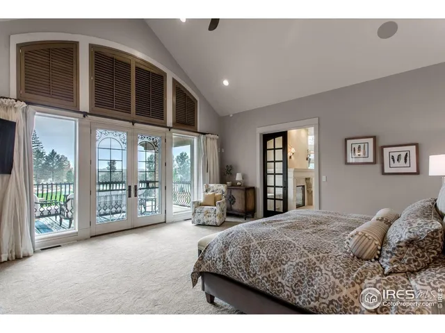 a view of a chairs and table on the roof deck
