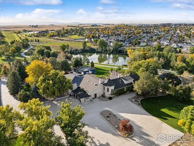 an aerial view of a house with a lake view