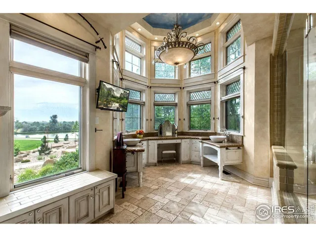 a bathroom with a sink mirror and double vanity