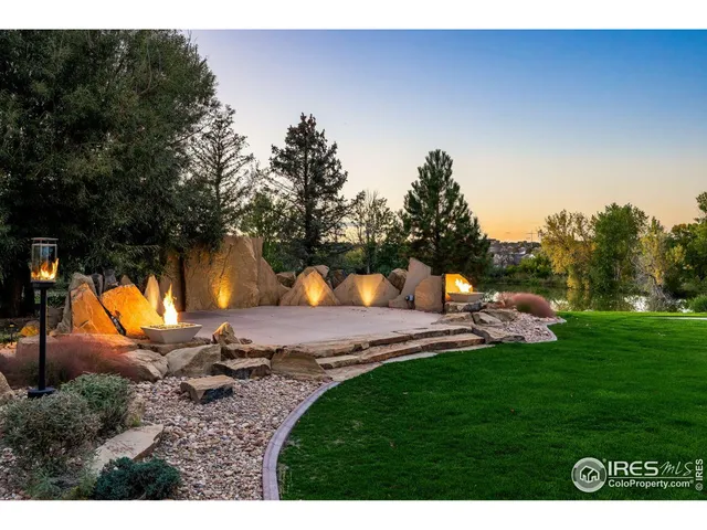 a view of a house with pool and chairs