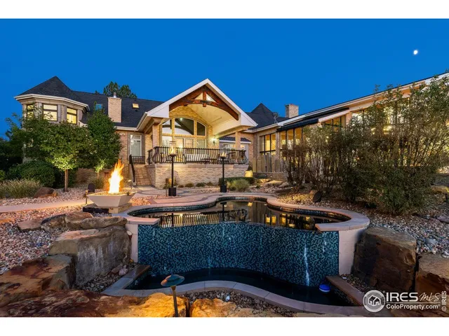 a swimming pool with outdoor seating