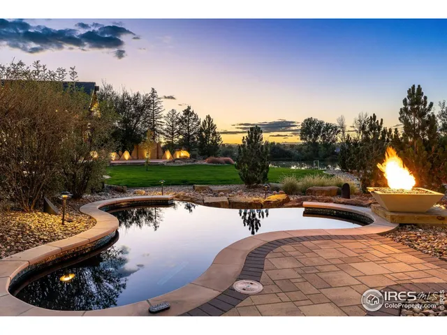a view of an house with backyard space and garden