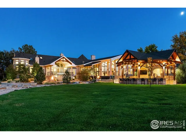 a view of a house with backyard porch and sitting area
