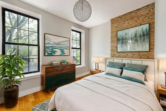 a bedroom with bed and a window