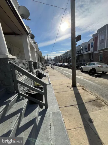 a view of a street with a patio