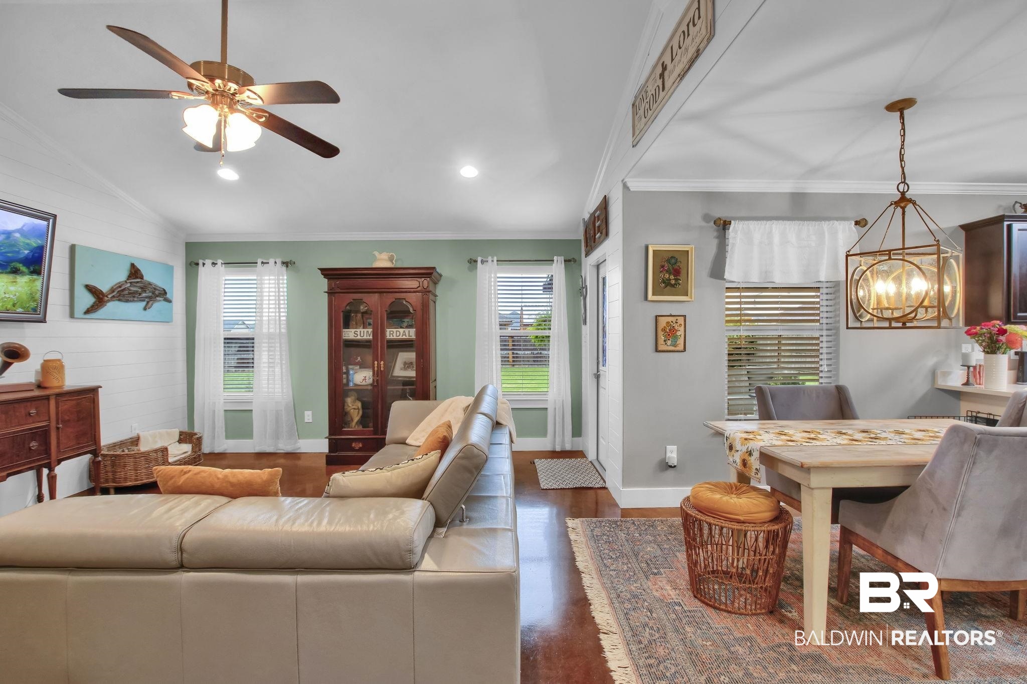 203 Lakefront Circle Summerdale, AL 36580 - Photo 13 of 69 Living room with ceiling fan with notable chandelier, dark wood-type flooring, vaulted ceiling, and crown molding
