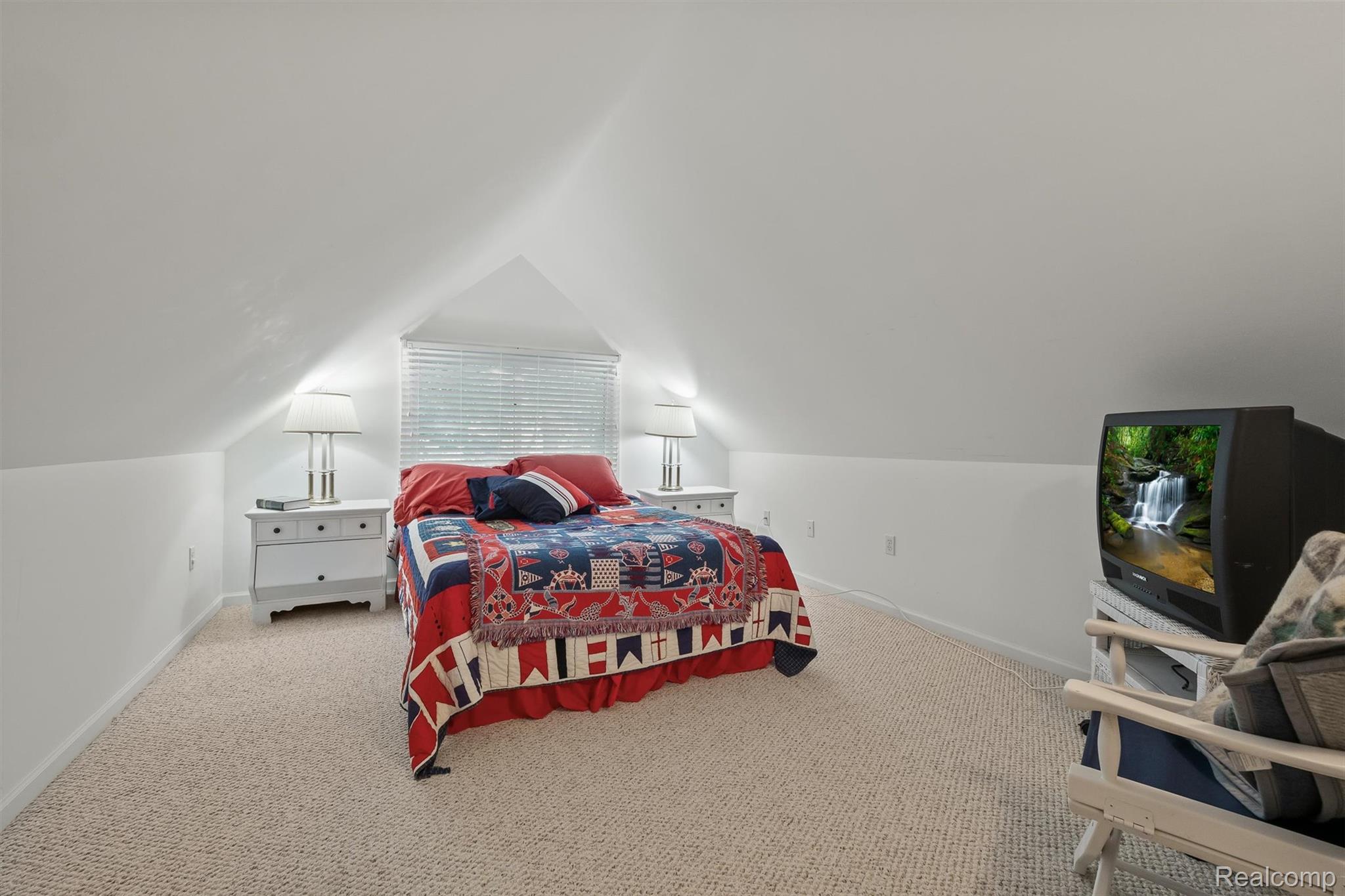 5892 Port Austin Road Caseville, MI 48725 - Photo 30 of 42 Carpeted bedroom with baseboards and vaulted ceiling