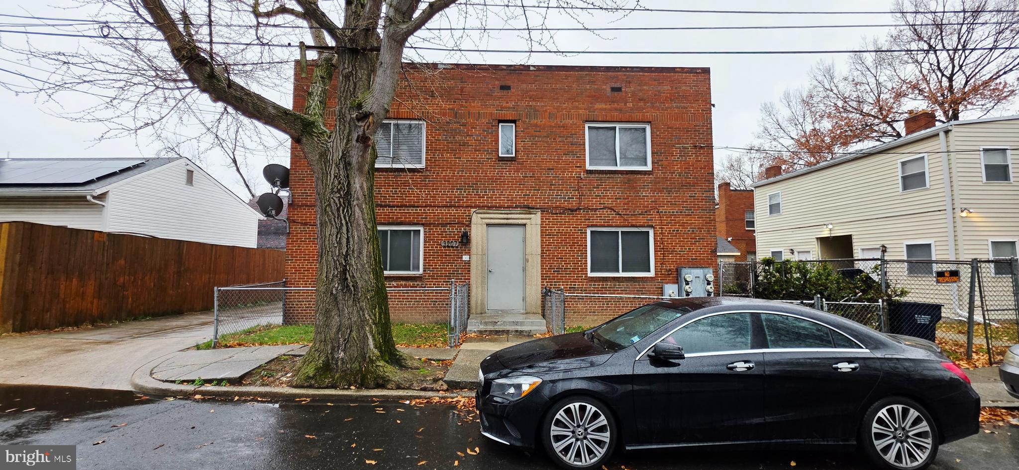 a front view of a house with parking space