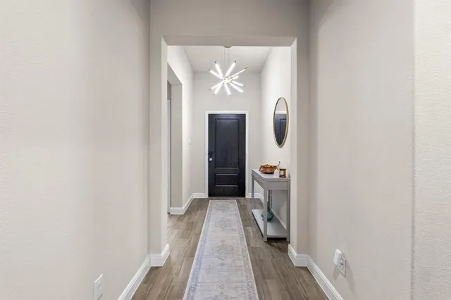 a spacious bathroom with a toilet a sink and mirror
