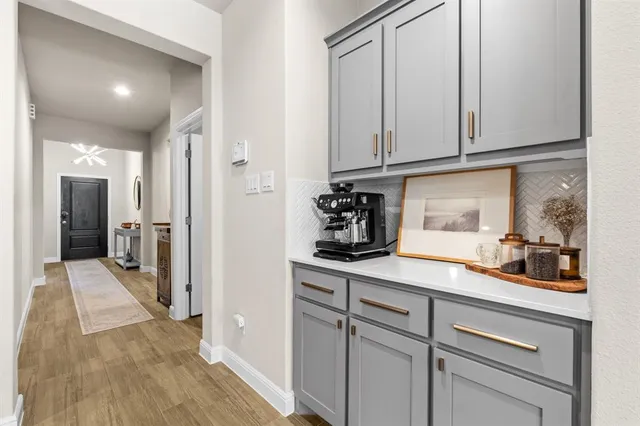 a view of a white house with a outdoor space and shower