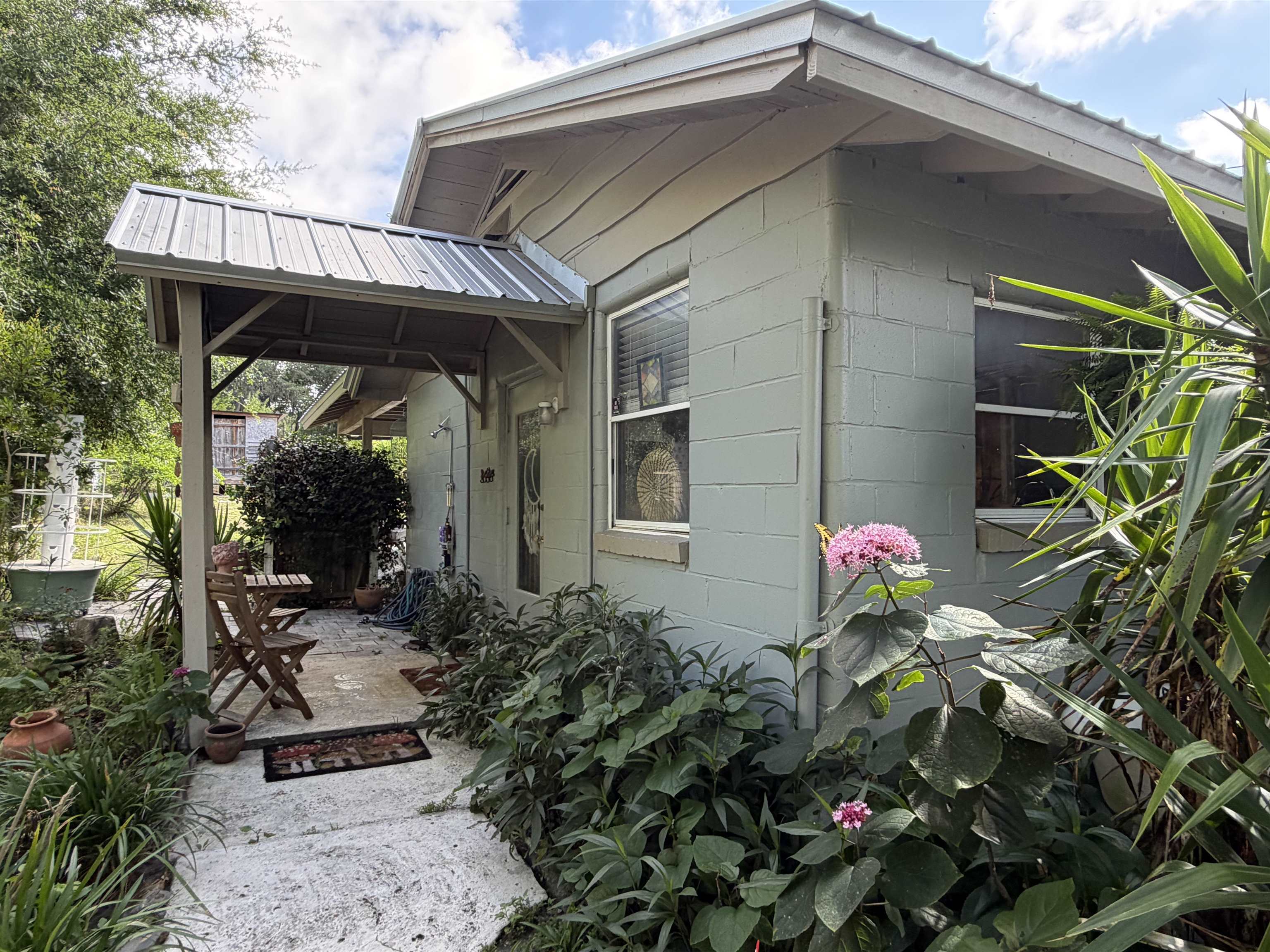 323 Sisco Road Pomona Park, FL 32181 - Photo 16 of 31 a front view of a house with a yard