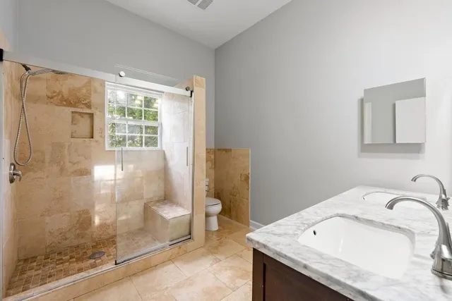 a bathroom with a sink and a shower