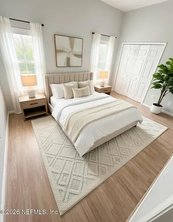 a bedroom with a bed and a window