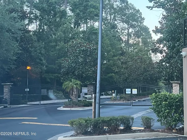 a front view of a building with tree s
