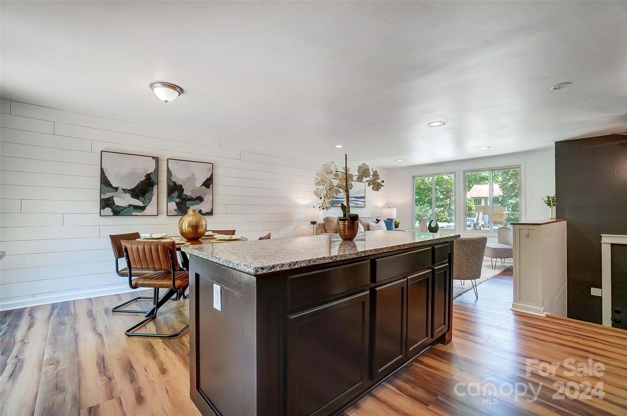 2236 Rice Planters Road Charlotte, NC 28273 - Photo 13 of 43 a kitchen with a sink cabinets and wooden floor
