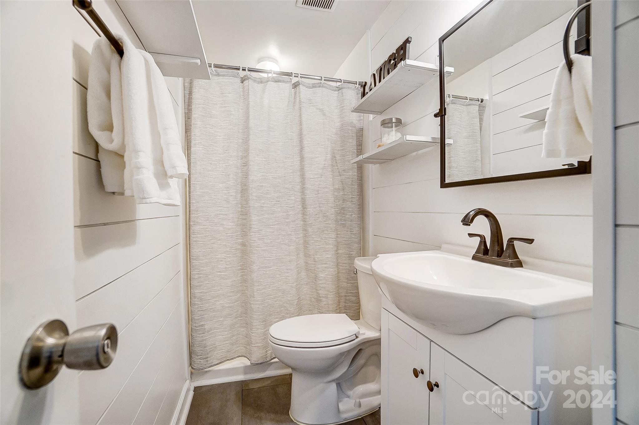 2236 Rice Planters Road Charlotte, NC 28273 - Photo 20 of 43 a bathroom with a sink a toilet and shower