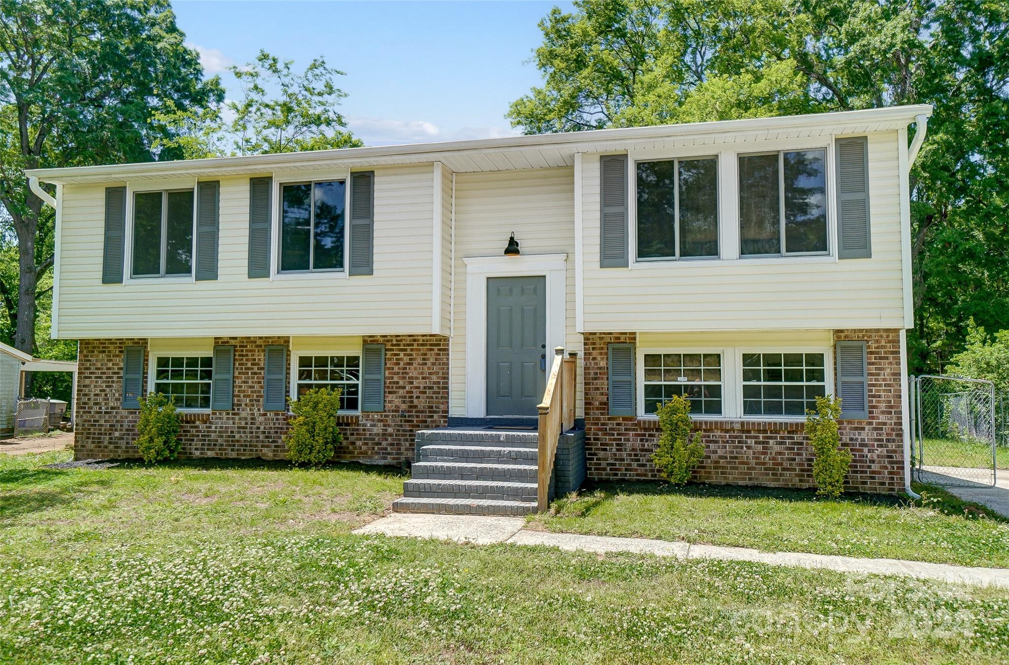 2236 Rice Planters Road Charlotte, NC 28273 - Photo 2 of 43 a front view of a house with garden